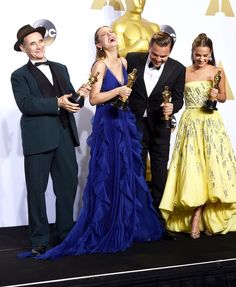 three men and two women posing with their oscars for the film's best actress