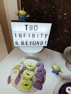 two infinity and beyond cookies on a plate