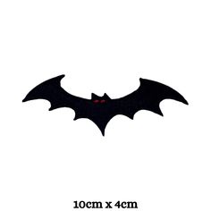 an image of a bat with red eyes on it's back and the words 10cm