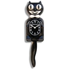 a black cat clock with white numbers on it's face and tail, sitting in front of a white background