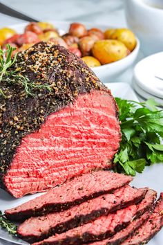 a large piece of meat on a white plate