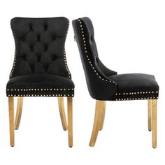 a pair of black chairs with studded wooden legs and back rests against each other