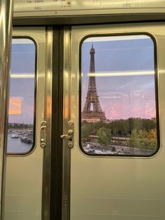 the eiffel tower seen through two open doors