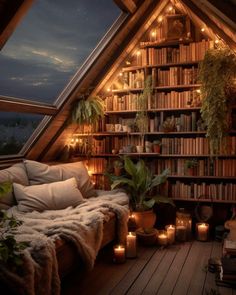 an attic bedroom with bookshelves, plants and candles on the floor in front of it