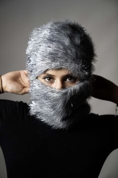 This Sparkly Gray Plush mask features a soft and plush texture, making it both comfortable and stylish. The fringe cord details add movement and a unique touch, while the open eye and nose sections ensure easy breathing and visibility. Designed to elevate your everyday look, this mask is perfect for nightclubs, festivals, and parties, helping you stand out in any crowd. Additionally, it serves as a functional accessory for cold weather or outdoor events, blending style and practicality effortlessly. Motorcycle Mask, Custom Mask, Unique Faces, Costume Mask, Ski Mask, Functional Accessories, Outdoor Events, Special Design, Night Club