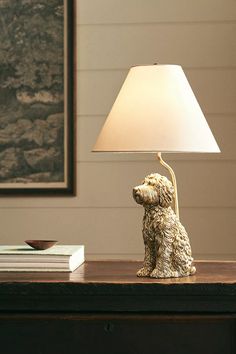 a dog lamp sitting on top of a wooden table