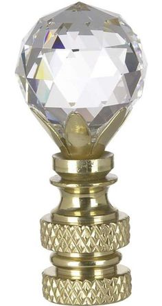 a golden knob with a crystal facet on it