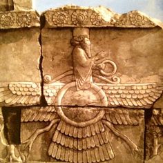 an ancient relief depicting a winged bird