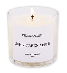 a candle that is sitting in front of a white background with the words juicy green apple on it