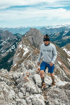 a man standing on top of a rocky mountain