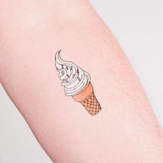 an ice cream cone tattoo on the right arm is shown in this close up photo