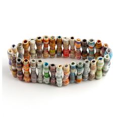 a bracelet made out of many different colored spools