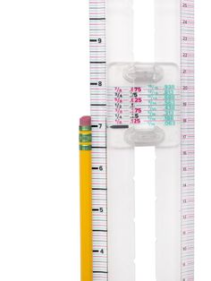 two plastic rulers and a pencil on a white background with clippings for measuring