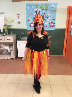 a woman wearing a colorful costume in a classroom