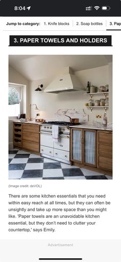 a kitchen with white cabinets and black and white checkered flooring on the walls