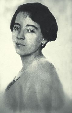 an old black and white photo of a woman