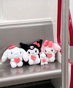 the stuffed animals are lined up on the bus seat for passengers to sit down in