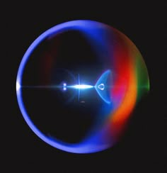 an image of a colorful object in the dark with light coming from it's center