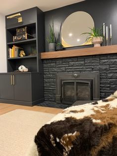 a living room filled with furniture and a fire place