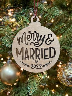 merry and married ornament hanging on a christmas tree