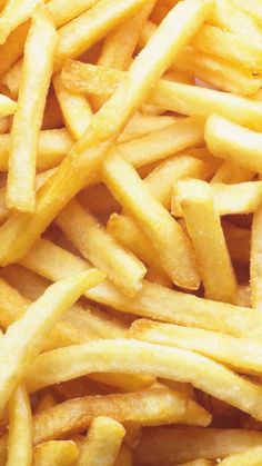 french fries are piled on top of each other