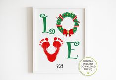 a christmas card with the word love written on it and a handprinted foot print