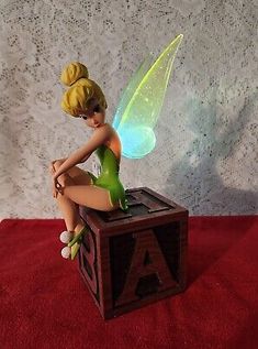 DISNEY PARKS Peter Pan TINKER BELL Alphabet Block Light up Wings Figurine RARE  | eBay Peter Pan Lamp Silhouette, Tinker Bell Room, Light Up Wings, Peter Pan Nursery, Fairy Bedroom, Dream Nursery, Fairy Cosplay, Alphabet Blocks, Disney Figurines