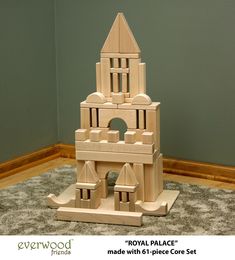 a wooden model of a royal palace made with 6 piece core set on carpeted floor