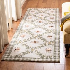 a living room area with a rug on the floor