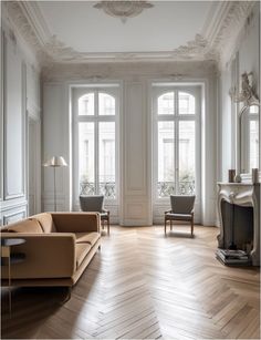 an elegant living room with white walls and wood floors