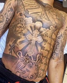 a man with many tattoos on his chest