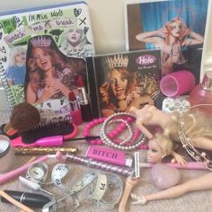 there are many items that can be found on the floor, including barbie dolls and makeup