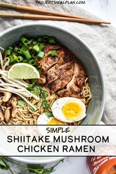 a bowl of chicken ramen with an egg on top and chopsticks next to it