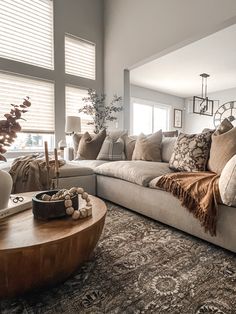 a living room filled with furniture and pillows