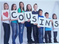 a group of people holding up signs that say i love cousins