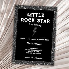 a little rock star is on the way birthday party with black and silver sparkles