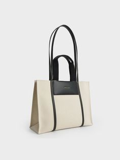 A bag to beat all other bags when it comes to structure, style or functionality. Featuring a boxy finish, double top handles, and a roomy interior, our boxy canvas Shalia tote is perfectly sized to carry all of your essentials in style. Relish being hands-free when you wear it on your shoulder and head to work. Complete with a zip closure that ensures your daily necessities stay safe, we think it will go well with a pinstripe pantsuit and textured mules. Charles And Keith Bags, Charles And Keith, Uni Style, Buy Bags, Flatform Sandals, Charles Keith, Everyday Bag, Online Bags, Relish