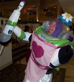 a man dressed as buzz lightyear from toy story