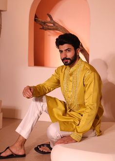 Introducing hasrat kurta with hand embroidery on hem & yoke consisting detailed thread, sequence, mirror and bead work with inside lining. Designer Cotton Silk Bandhgala For Festivals, Navratri Long Sleeve Sherwani With Gota Work, Navratri Sherwani With Gota Work And Long Sleeves, Traditional Drape Kurta With Dabka Work In Cotton Silk, Cotton Silk Kurta With Dabka Work In Traditional Drape, Long Sleeve Raw Silk Kurta With Gota Work, Bollywood Style Designer Cotton Silk Bandhgala, Eid Cotton Silk Bandhgala With Dabka Work, Festive Bandhgala With Gota Work For Eid