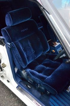 the interior of a car with blue carpet