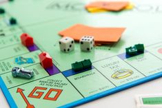 a monopoly board game with dice and pieces on it