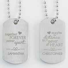 two dog tags with the words together forever and never on them hanging from a ball chain