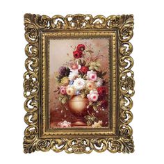 an ornate gold frame holds a painting of flowers in a golden vase on a white background