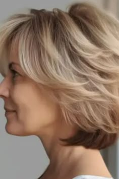 For a soft touch, consider opting for a soft feathered bob. This hairstyle adds movement and lightness with its feathered layers making it perfect for those with medium to fine hair. Click here to check out more stunning short hairstyles for women over 40 in 2023.