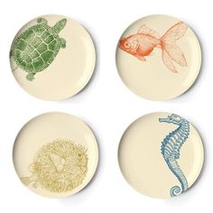 four plates with sea animals on them are arranged in the shape of three different designs