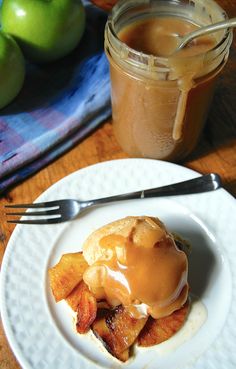 a plate with some food on it next to a jar of caramel apple jam