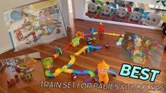 the best train set for babies and toddlers is on the floor next to toys