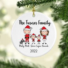 a family ornament hanging from a christmas tree