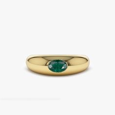 This 14k Gold Dome ring showcases a gorgeous 6x4mm oval cut natural emerald in a rich green color. The emerald is flush set in a 14k gold dome band that adds a touch of elegance and luxury to the ring. The emerald is considered as a symbol of love, growth, and rebirth. As the birthstone for May, this ring is a perfect way to celebrate a birthday or anniversary. The oval cut of the emerald adds a touch of vintage elegance to the ring, making it perfect for both formal and casual occasions. The 14k gold material of the band ensures the durability and longevity of the ring while adding a touch of warmth to it. ▶ Item Details * Made to Order * Gold Kt: 14K Solid Gold (also available in 18K) * Available Gold Colors: Rose Gold, Yellow Gold, White Gold * Oval Emerald: 1 pc 6 X 4 MM * Emerald Cara Oval Emerald Birthstone Ring In Fine Jewelry Style, Timeless Yellow Gold Oval Emerald Ring, Timeless Yellow Gold Emerald Ring With Oval Shape, Oval Emerald Ring With Bezel Setting, Oval Polished Emerald Ring In 14k Gold, Oval Emerald Ring With Polished Finish In 14k Gold, Oval Emerald Ring In 14k Gold With Polished Finish, Classic Oval Cabochon Emerald Ring, Oval 14k Gold Emerald Ring