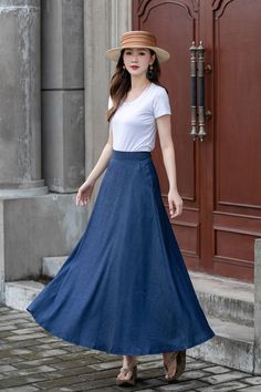 "Introducing our blue A-line high-waisted maxi skirt. This skirt is a timeless and versatile addition to your wardrobe. The A-line silhouette flatters every body shape, while the high-waisted design accentuates your waistline. Made from high-quality fabric, it offers a comfortable fit and effortless style. Whether you dress it up with a blouse and heels or go for a more casual look with a tucked-in t-shirt and sneakers, this skirt is perfect for any occasion. DETAILS: * Tencel blend * Two side pockets * Right zip closure * A litter Back elastic, comfortable wear * Plus size full skirt * Ankel length * Perfect for summer, autumn, spring * Dry clean MODEL SIZE Bust:85 cm(33.4\") Waist:67 cm(26.7\") Height 5'8\" (172cm) She wears size US 2 Choose CUSTOM Order if you * Need a better fit * Can' Non-stretch Maxi Skirt For Spring, Non-stretch Full Maxi Skirt, Flowy A-line Maxi Skirt In Solid Color, Summer A-line Maxi Dress With Pleated Skirt, Solid Color A-line Maxi Skirt For Summer, Relaxed A-line Maxi Skirt For Spring, Spring Solid Color A-line Maxi Skirt, Summer A-line Non-stretch Maxi Skirt, Non-stretch A-line Maxi Skirt For Summer